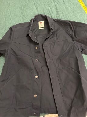 Fjallraven Men's Black Jacket with Red Logo Tag